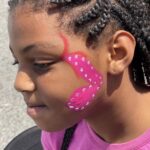 young girl with face paint