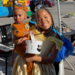 two girls in halloween costumes