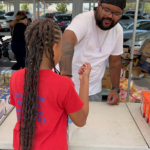 man and woman at community day event